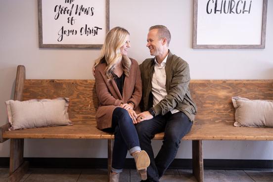 Jay and Sandy Smith of Cedar Park Church sitting on a wooden bench