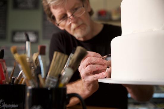 Jack Phillips works on a custom cake in his shop