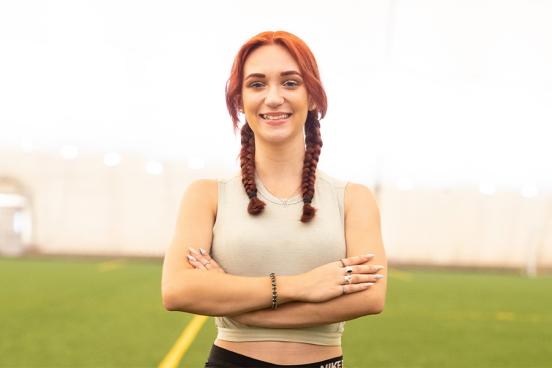 Selina Soule standing on an indoor field