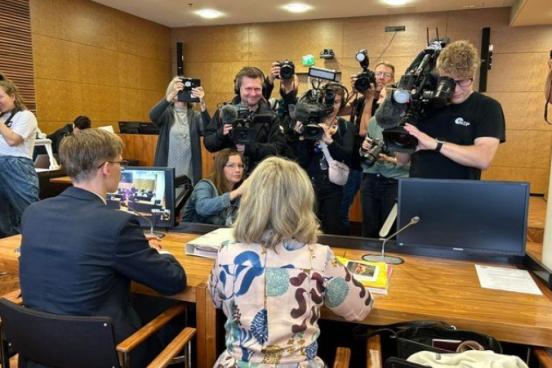 Paivi Rasanen is seen at her trial surrounded by media