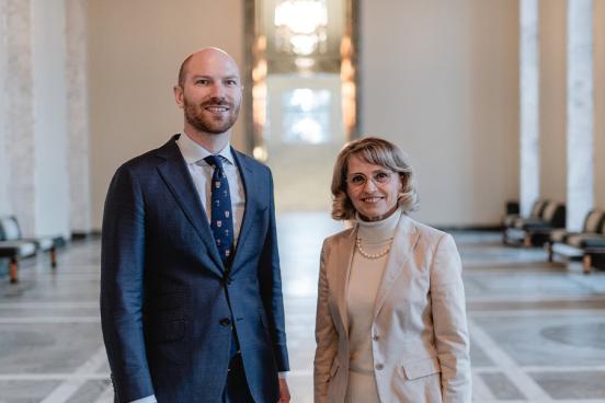 Paul Coleman with Päivi Räsänen in a hallway