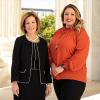 Lorie Smith of 303 Creative and Kristin Waggoner standing in front of the Supreme Court of the United States of America