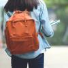 Teenage girl with orange backpack