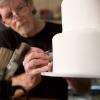 Jack Phillips works on a custom cake in his shop