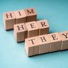 Pronouns are spelled out in wooden letter blocks 