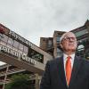 Dr. Allan Josephson stands outside the University of Louisville Health Outpatient Center on a cloudy day