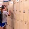 A girl in the Rapides Parish School District opens her locker